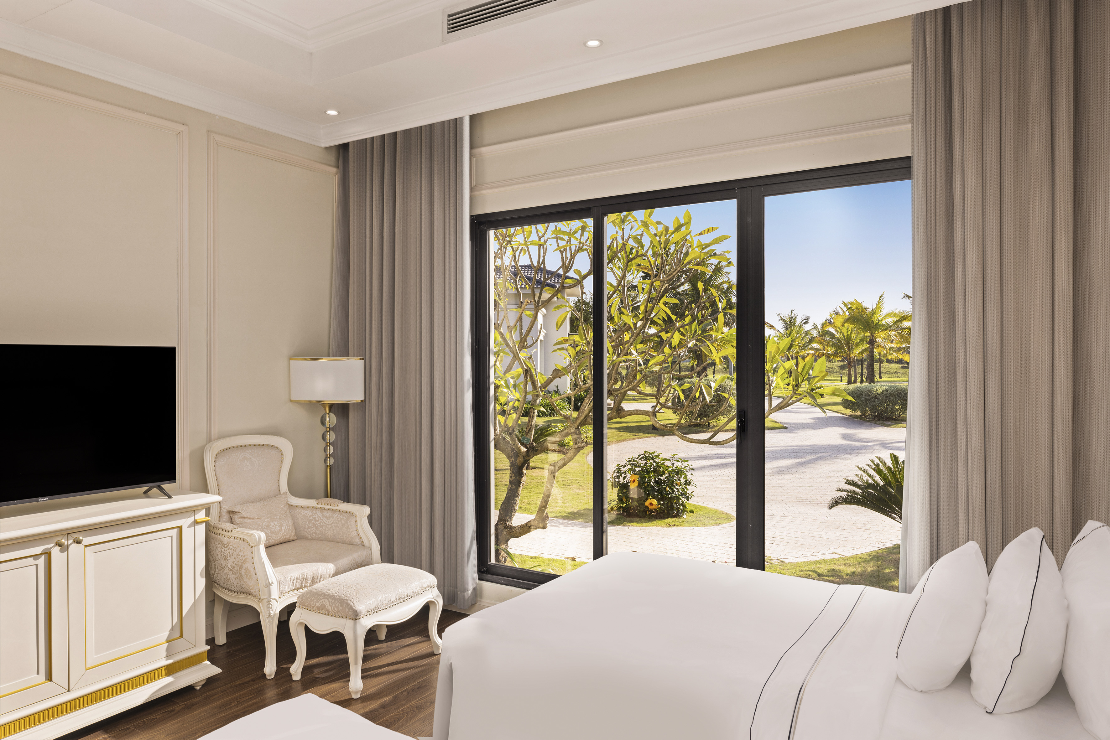 a bedroom with a large window