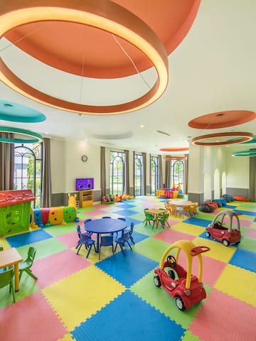a large room with colorful playroom
