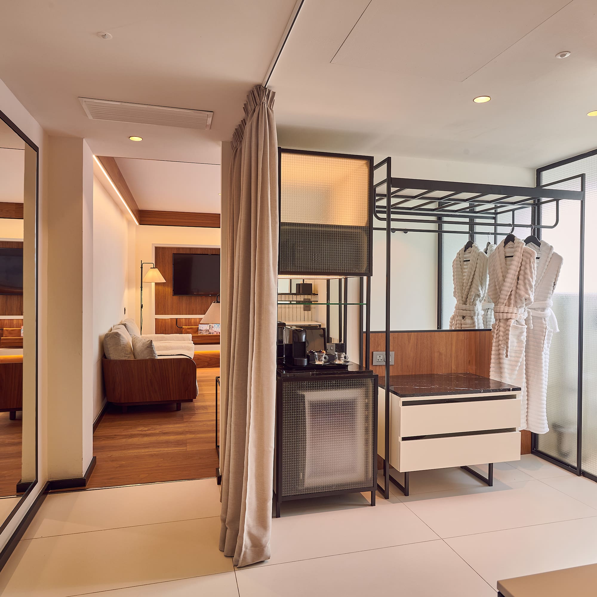 a room with a large closet and a tv