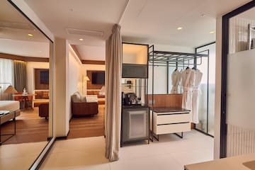 a room with a large closet and a tv