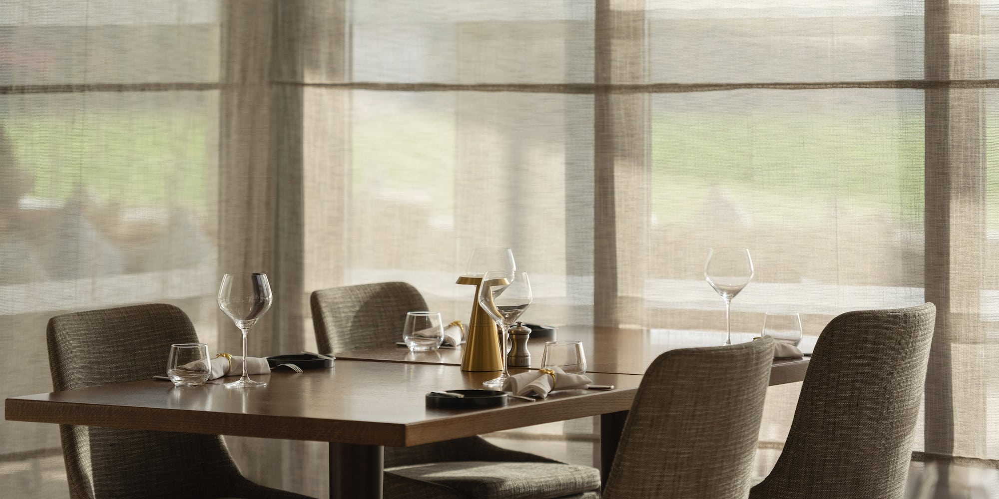 a table with glasses and plates on it