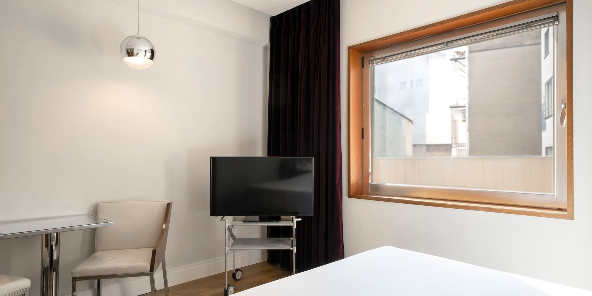 a room with a tv and a chair