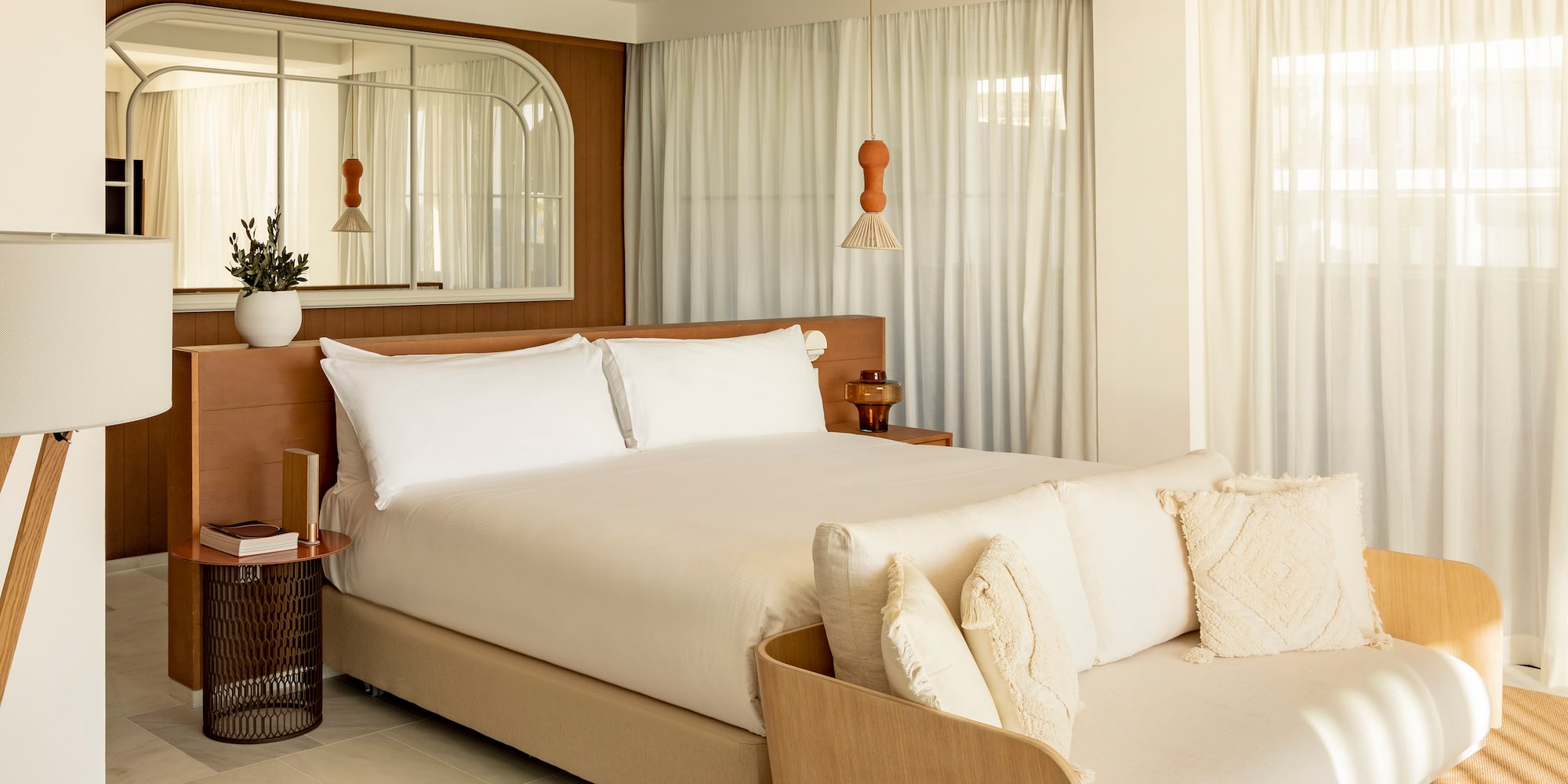 a bedroom with a bed and a fan