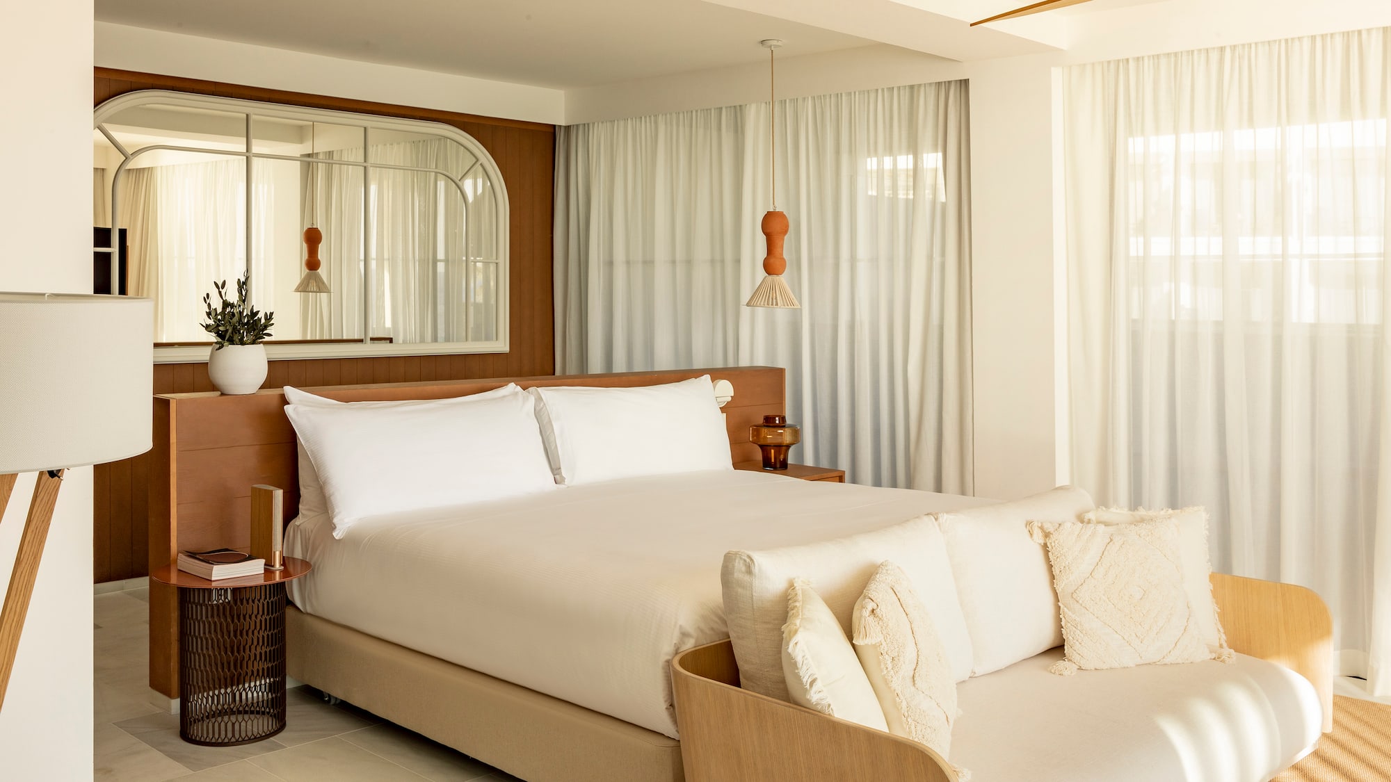 a bedroom with a bed and a fan