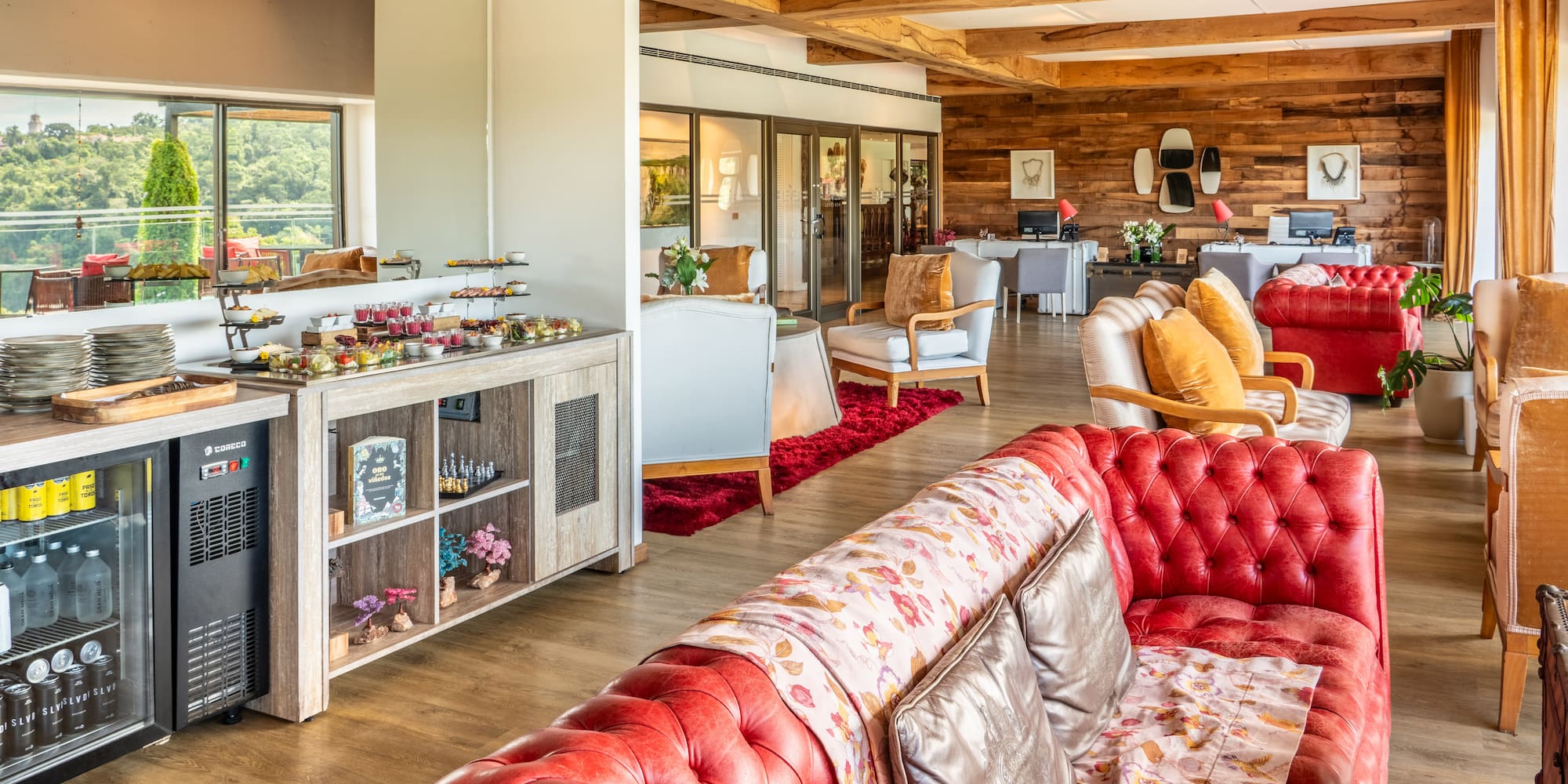 a room with a red couch and a red rug