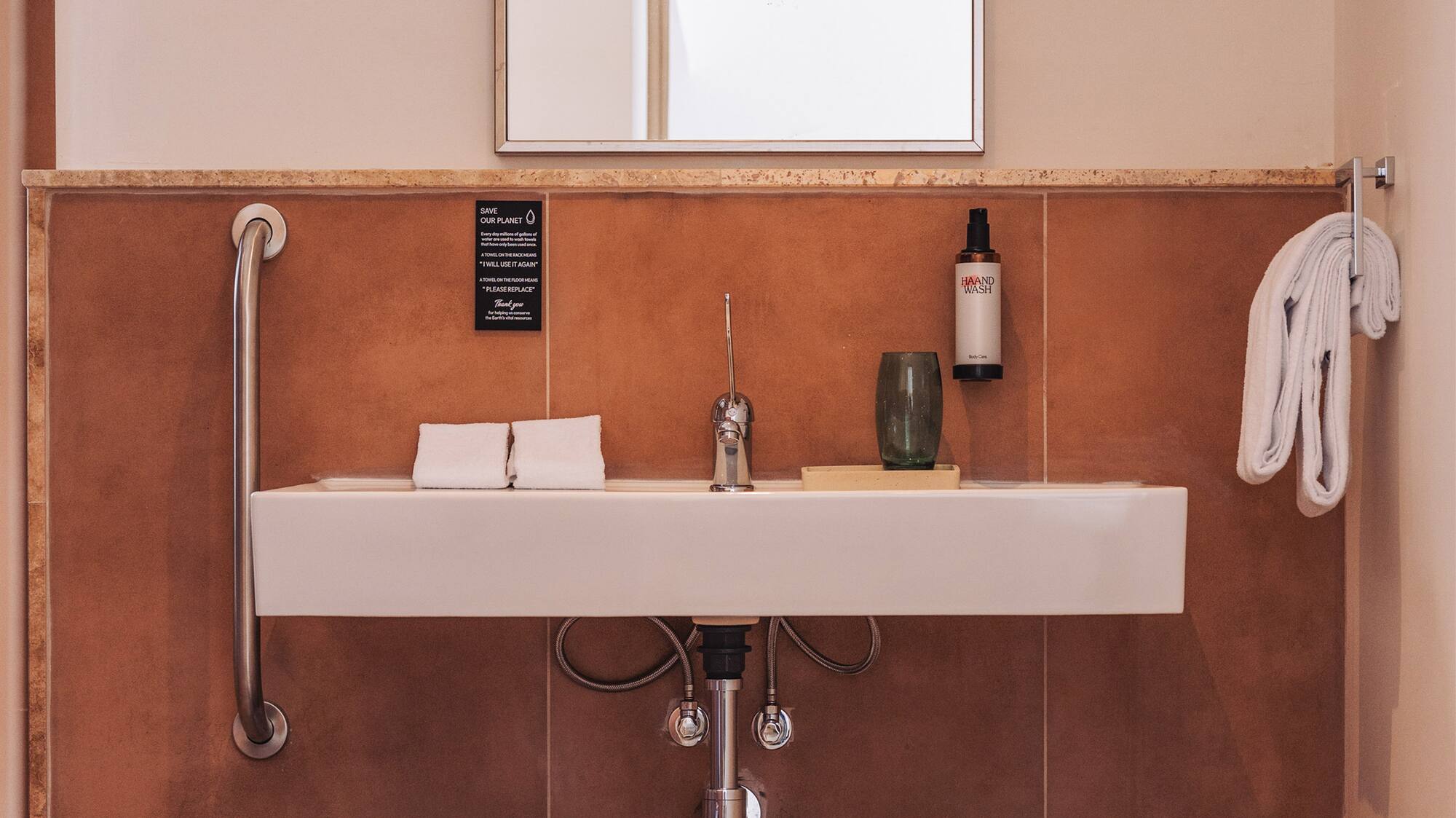 a bathroom with a sink and two baskets