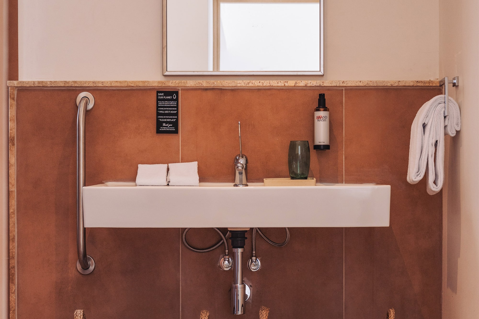 a bathroom with a sink and two baskets