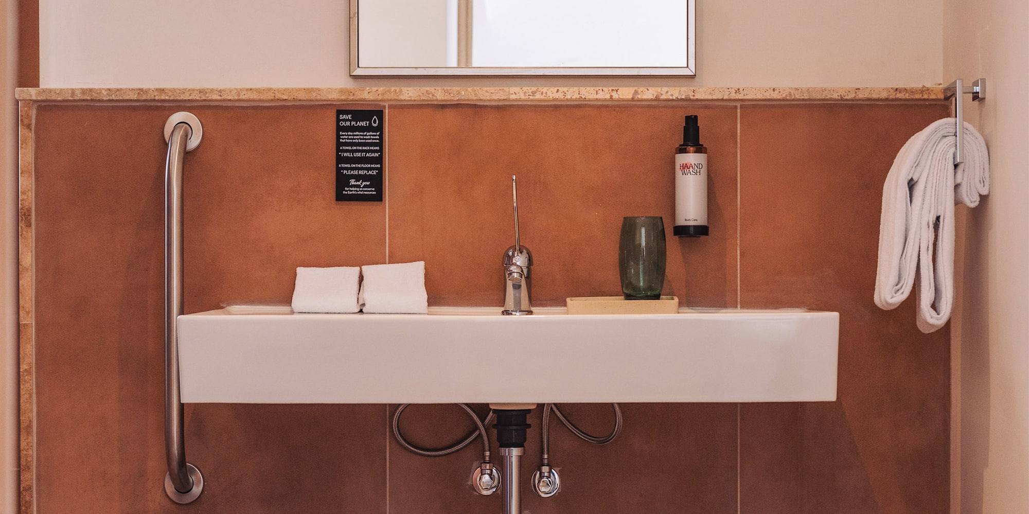 a bathroom with a sink and two baskets