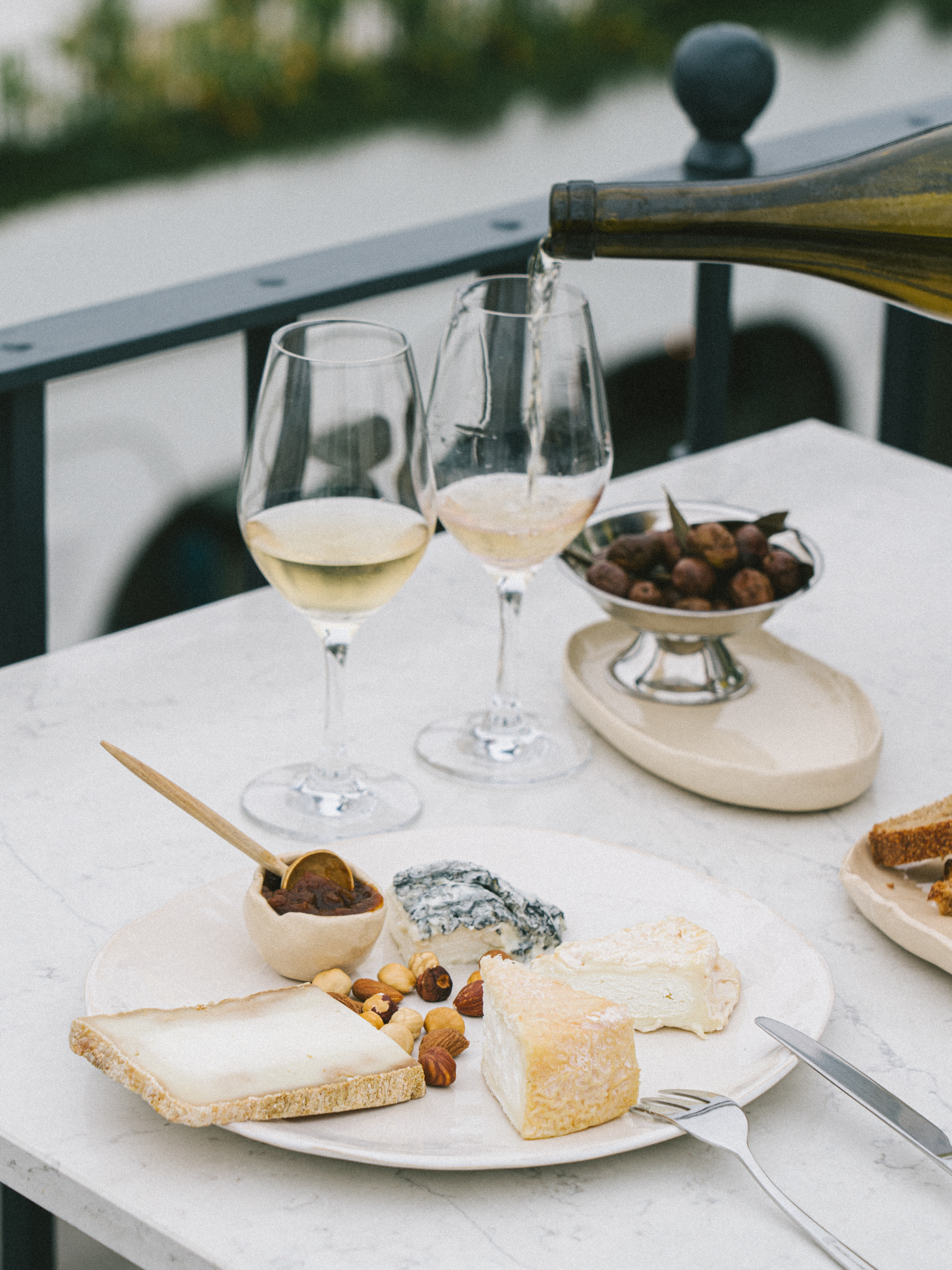 a plate of food and a glass of wine