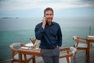 a man talking on a cell phone