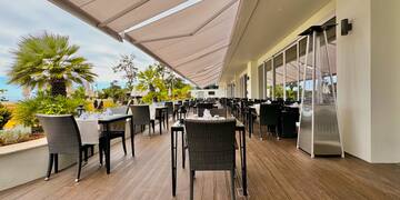a restaurant with tables and chairs