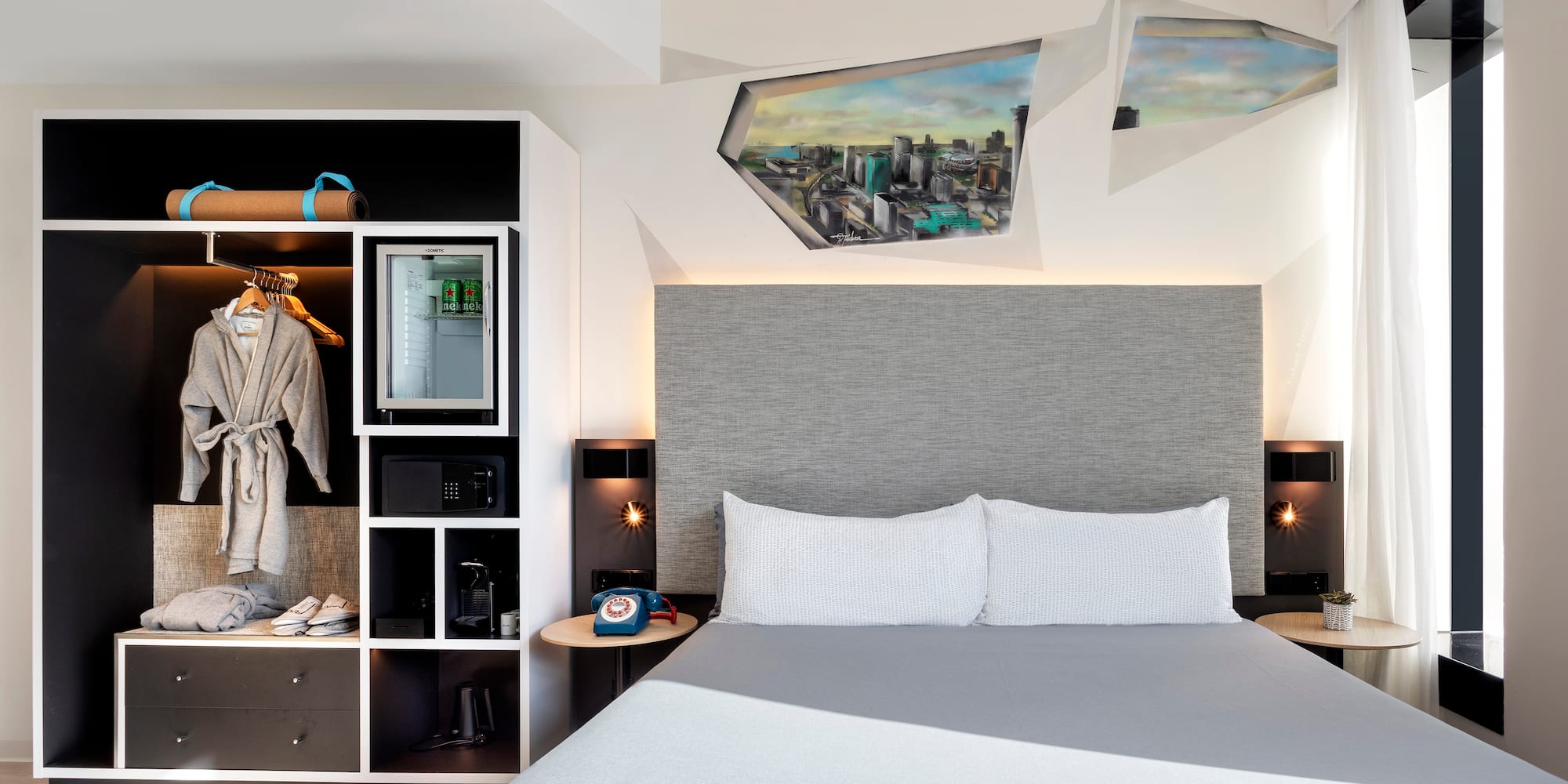 a room with a bed and a shelf