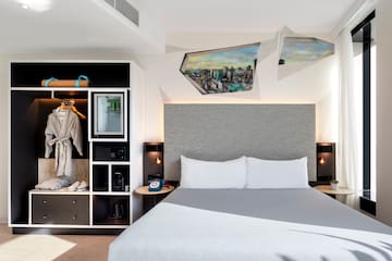 a room with a bed and a shelf