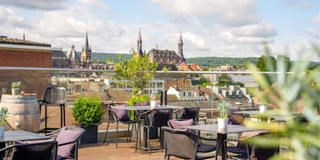 a table and chairs on a rooftop