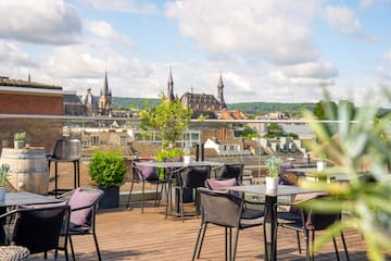 a table and chairs on a rooftop