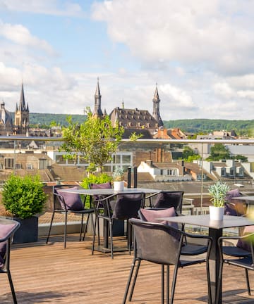 a table and chairs on a rooftop