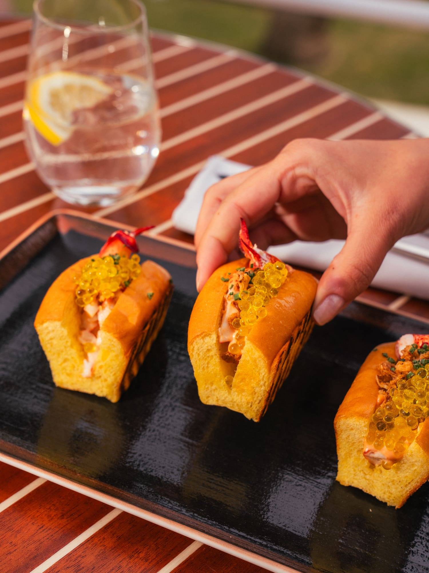 a hand holding a sandwich