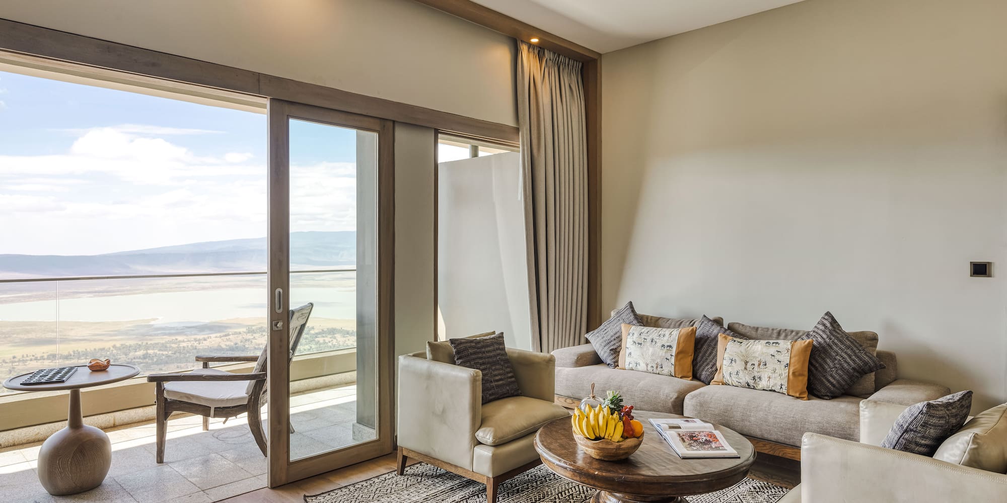 a living room with a glass door and a couch