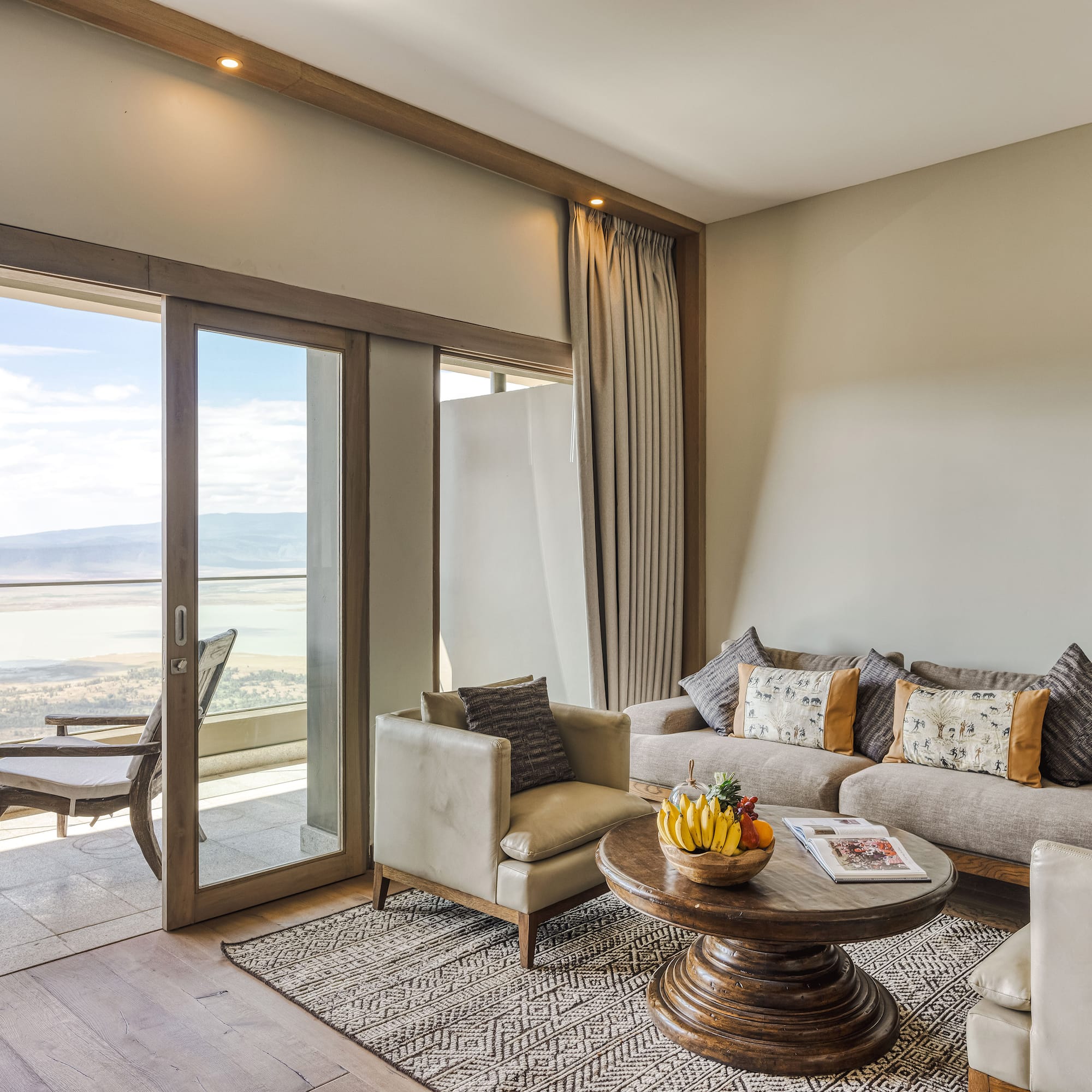 a living room with a glass door and a couch