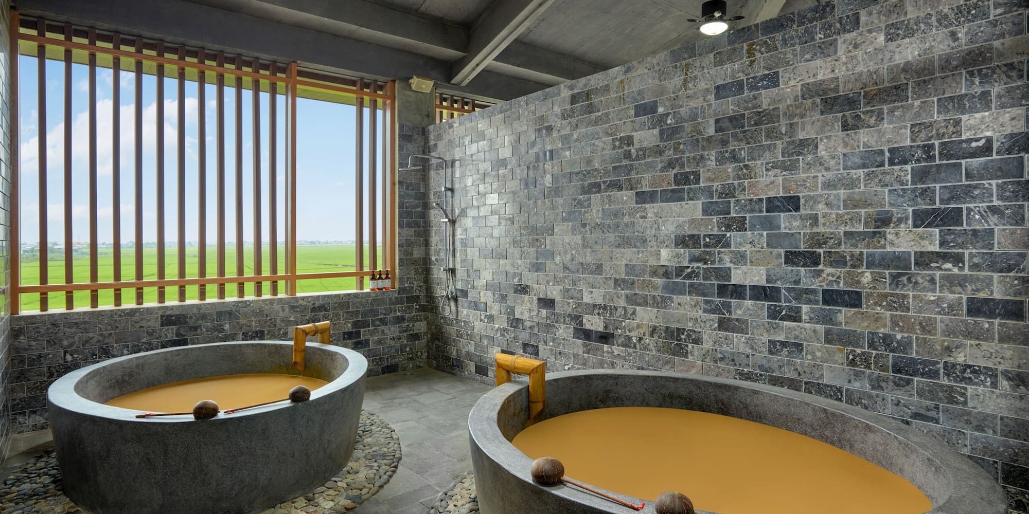 a large stone tubs with orange liquid in it