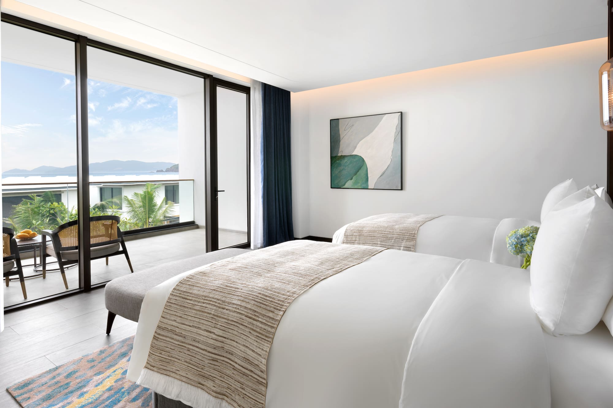 a bedroom with a chair and a bed