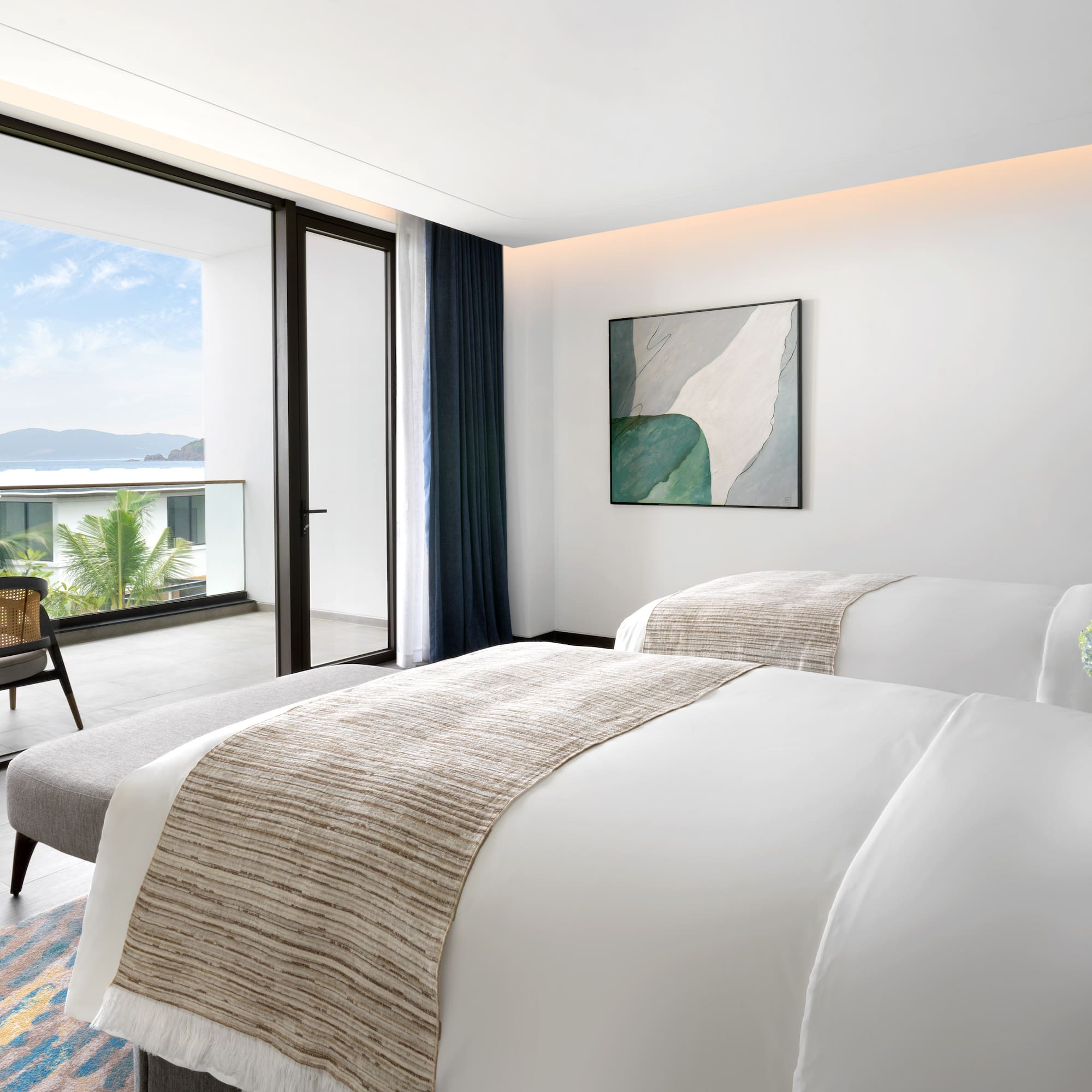 a bedroom with a chair and a bed