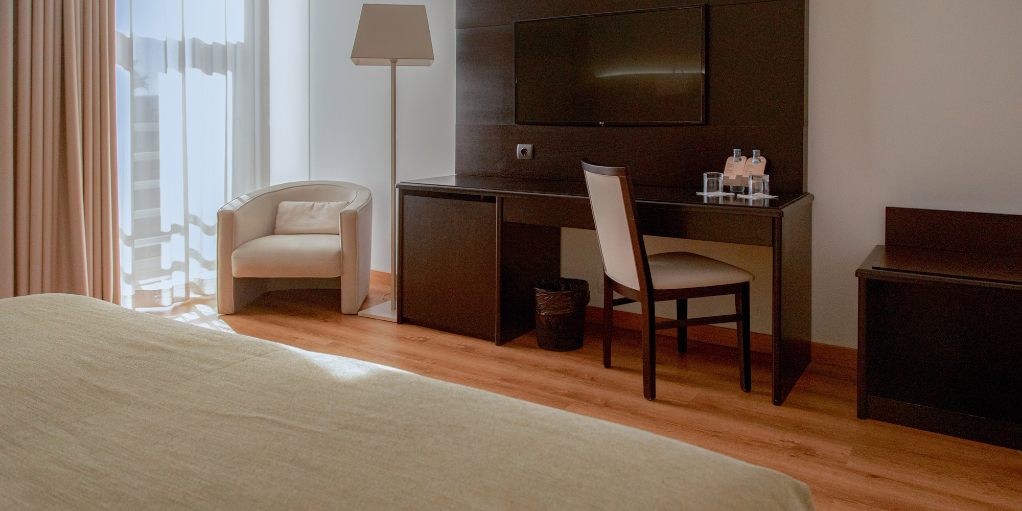 a room with a bed and a tv