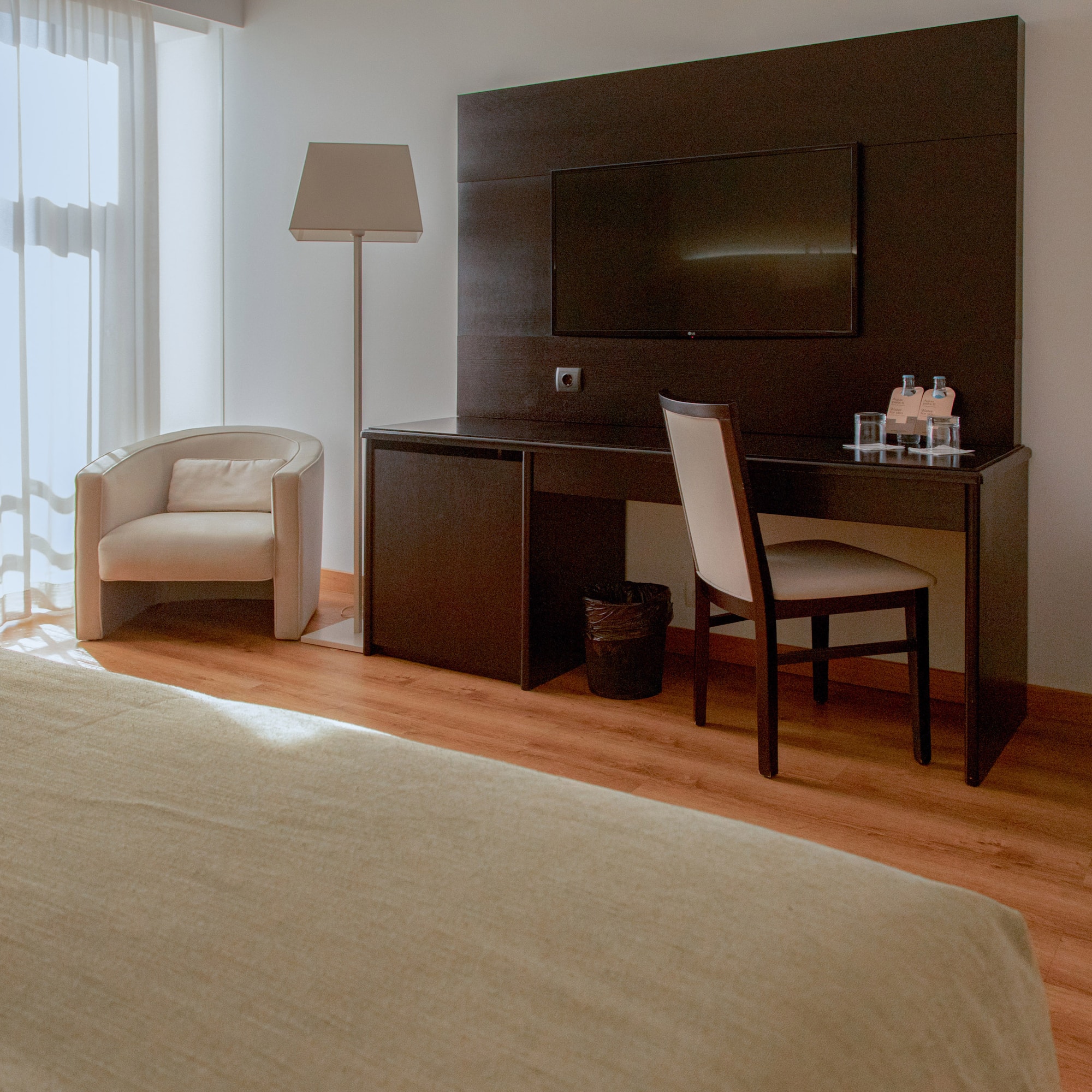 a room with a bed and a tv