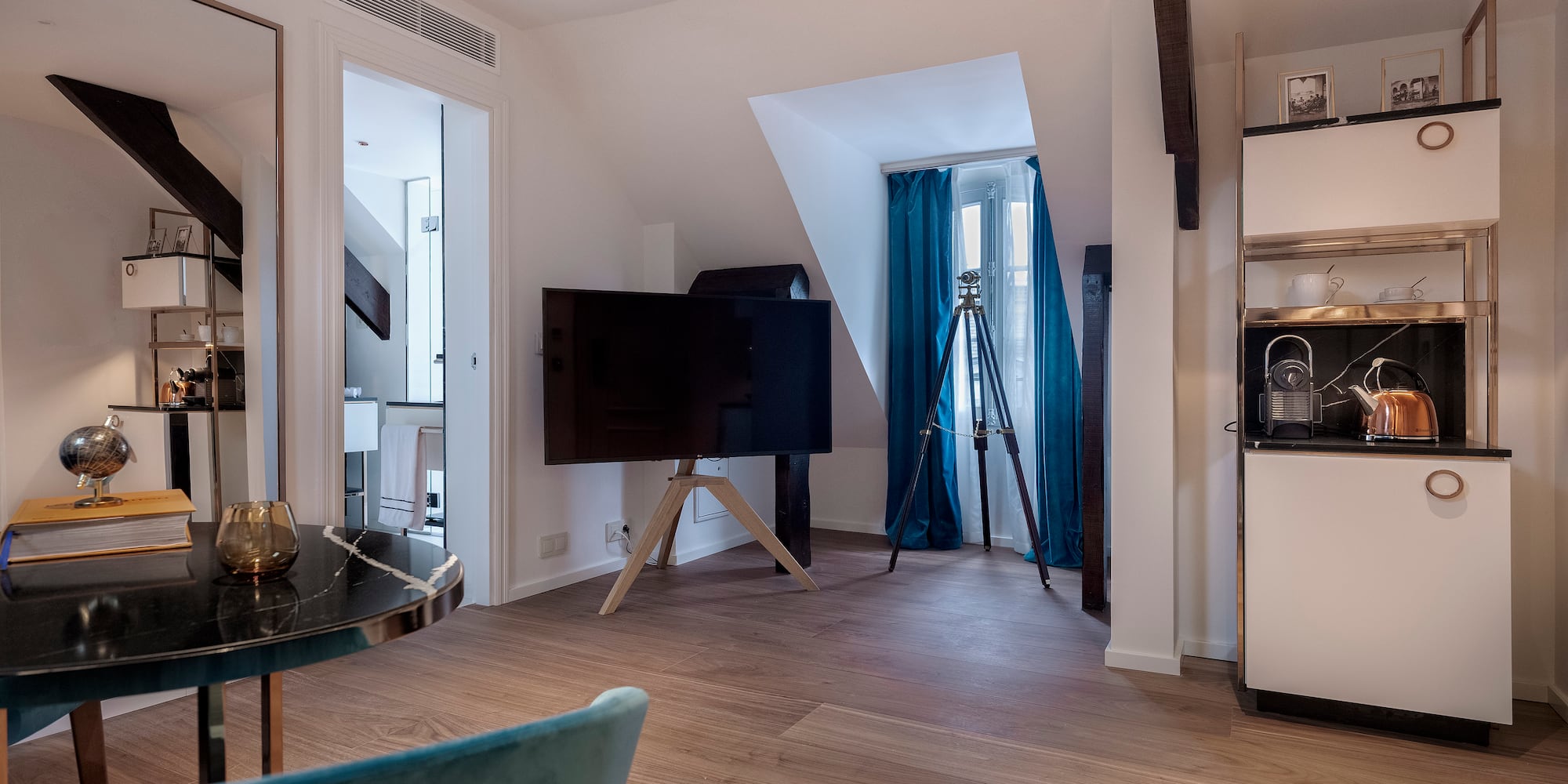 a room with a television and a tripod