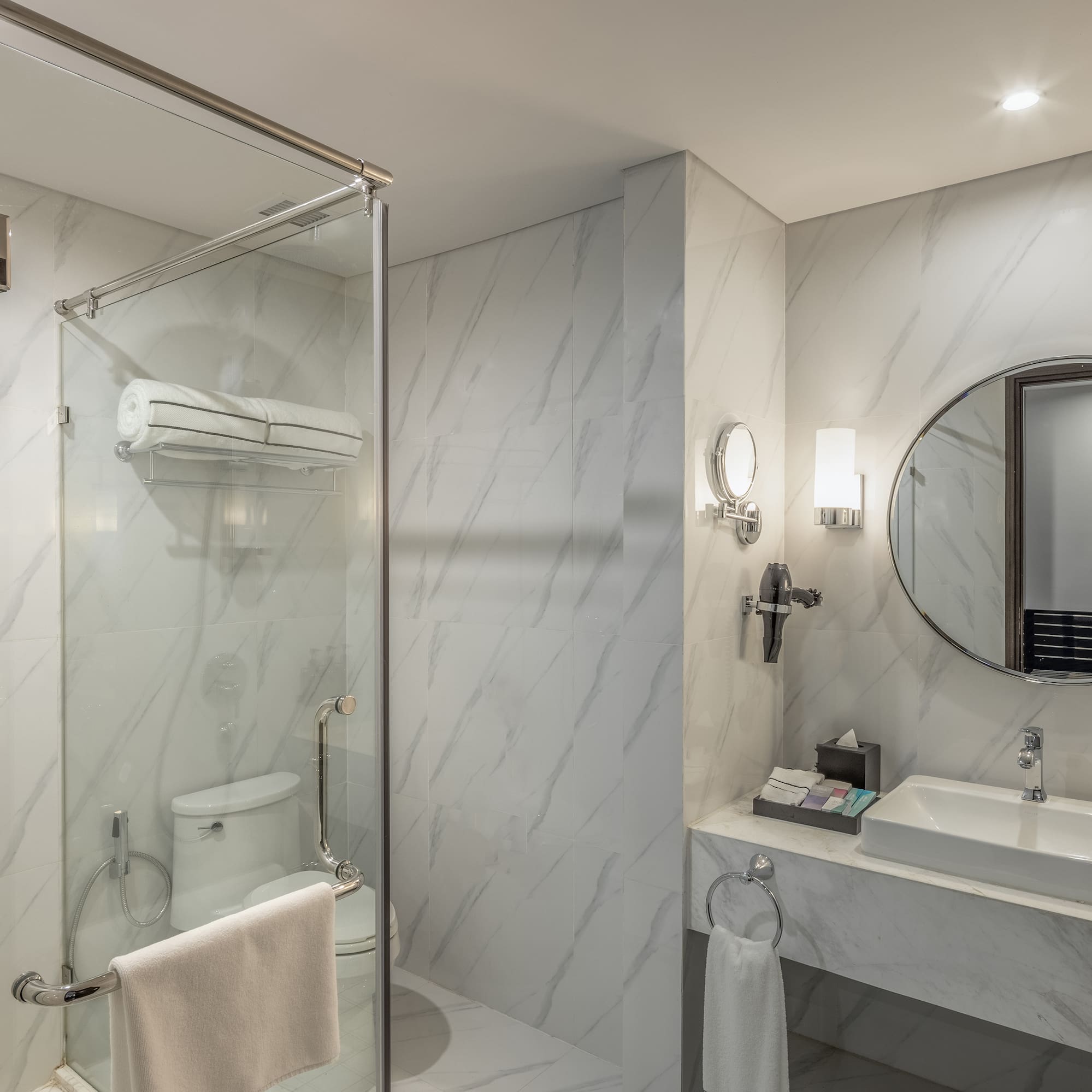 a bathroom with a mirror and a shower