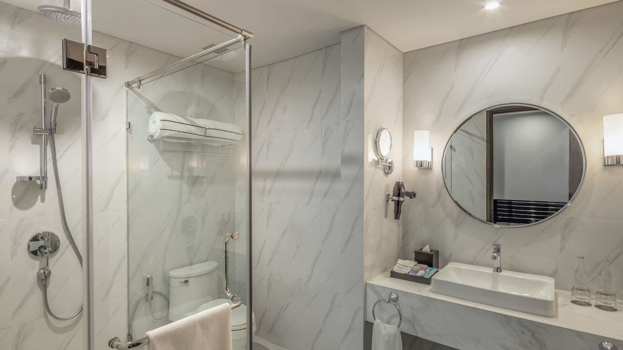 a bathroom with a mirror and a shower