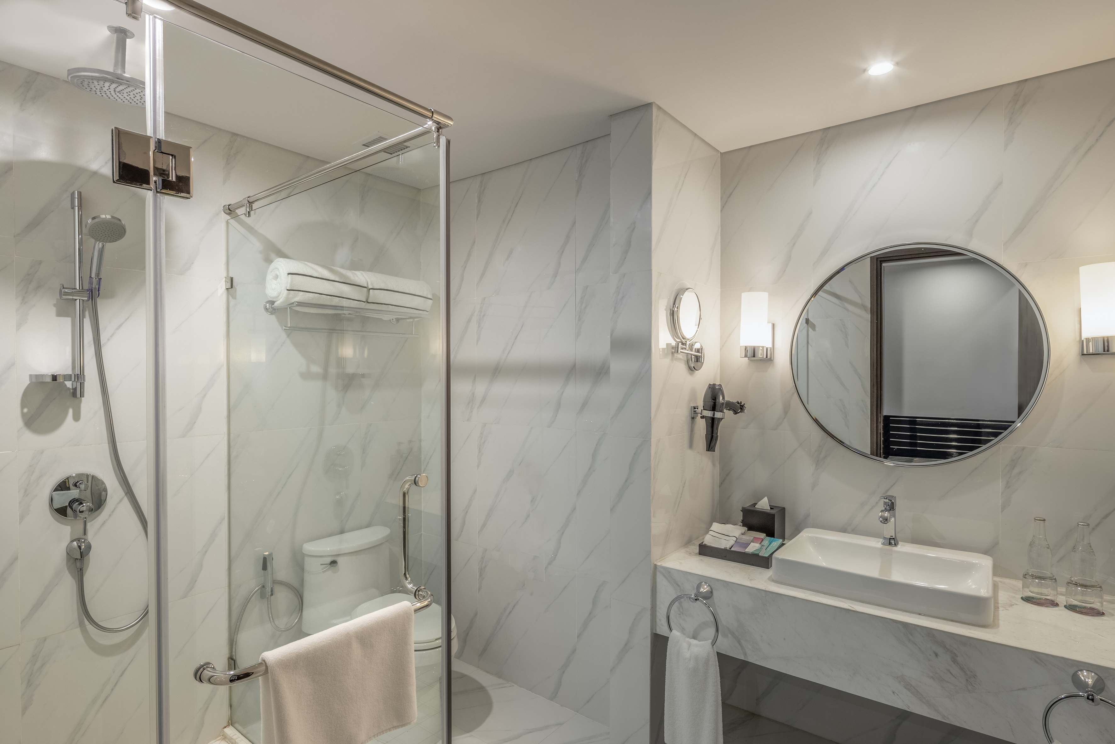 a bathroom with a mirror and a shower