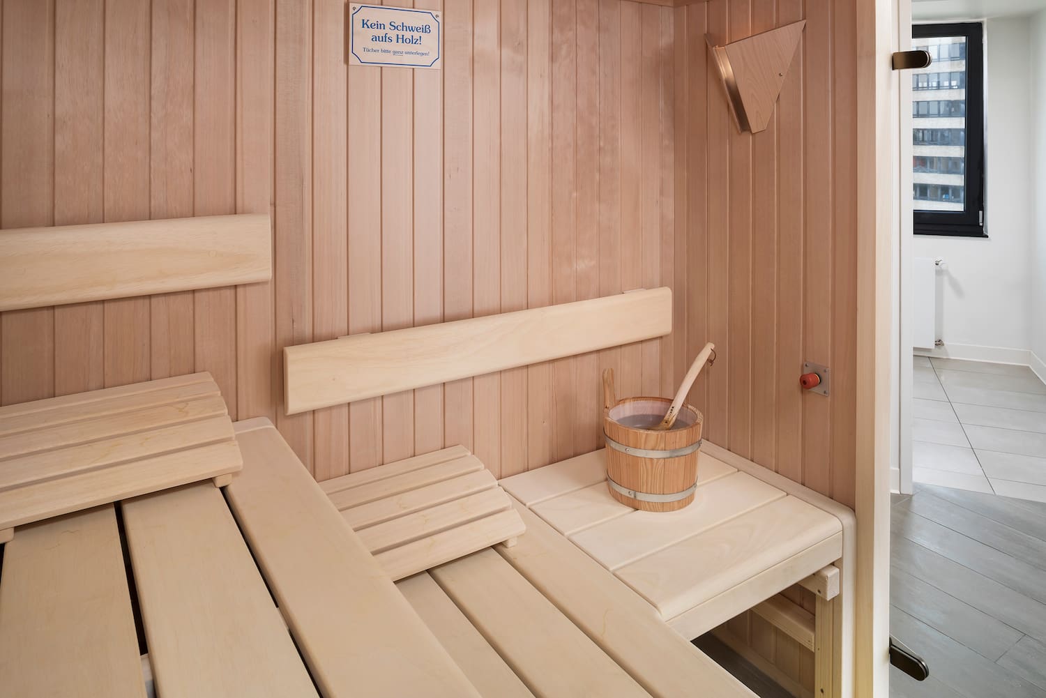 a wooden sauna with bucket and bucket