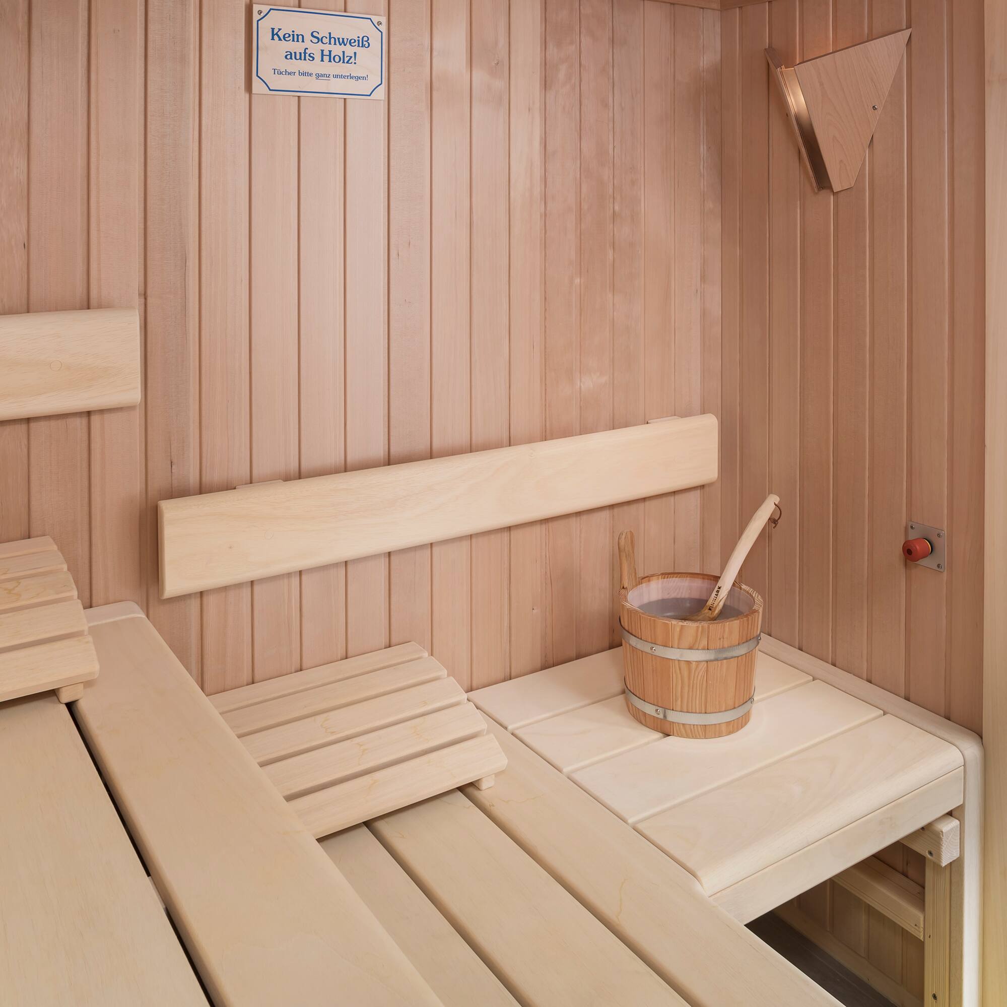 a wooden sauna with bucket and bucket