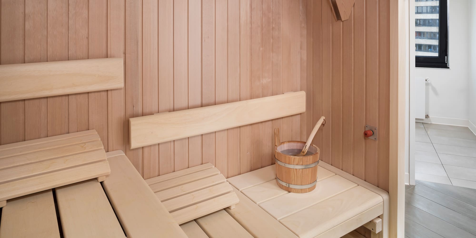 a wooden sauna with bucket and bucket