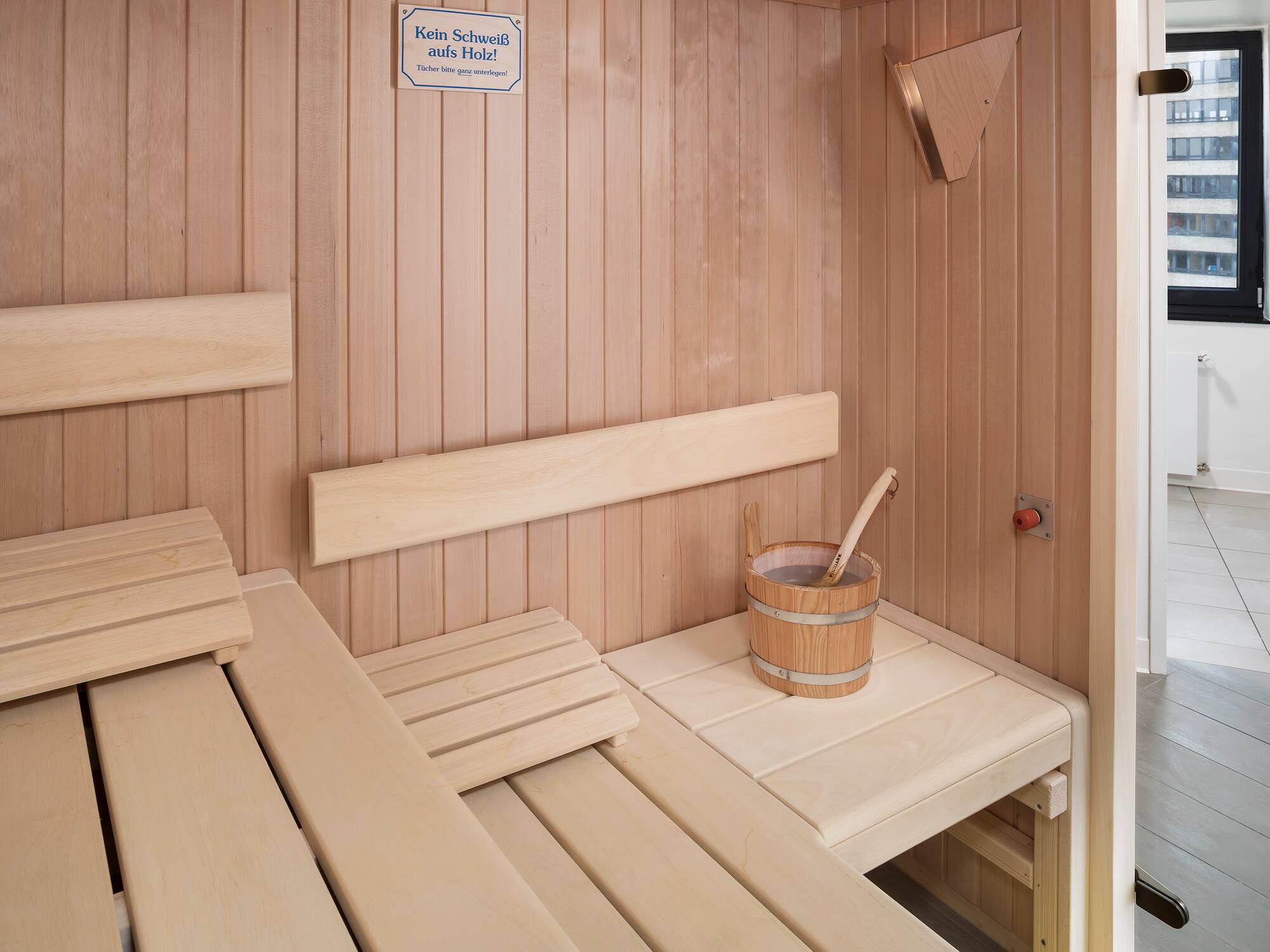 a wooden sauna with bucket and bucket