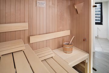 a wooden sauna with bucket and bucket