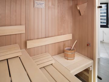 a wooden sauna with bucket and bucket