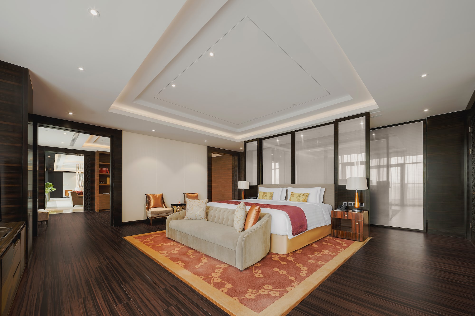 a room with a bed and a rug