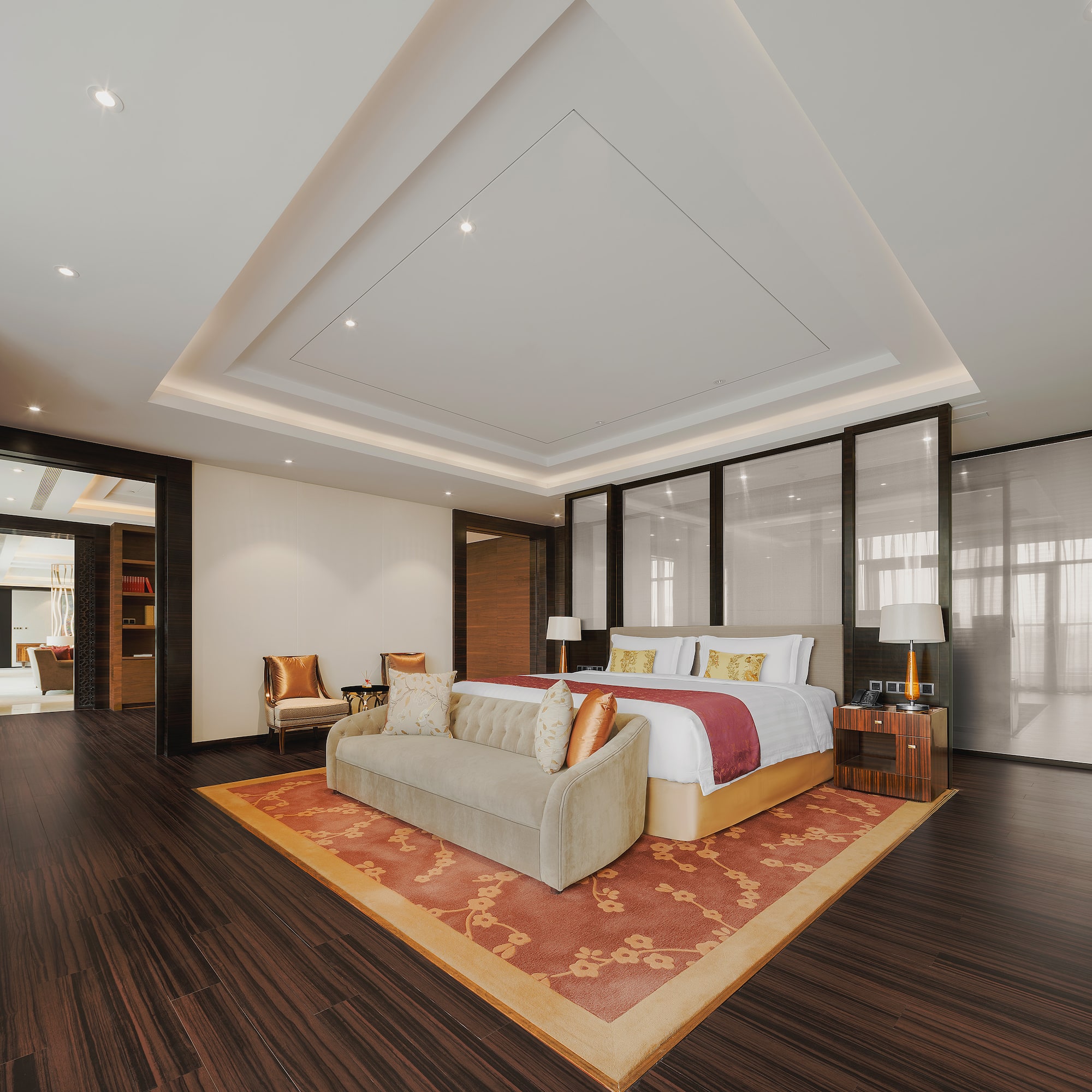 a room with a bed and a rug