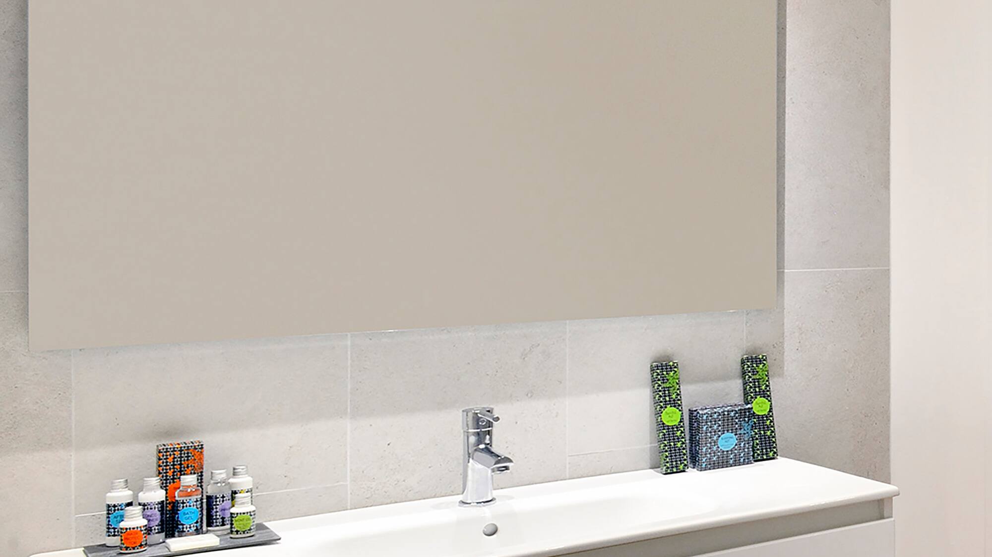 a bathroom with a mirror and sink