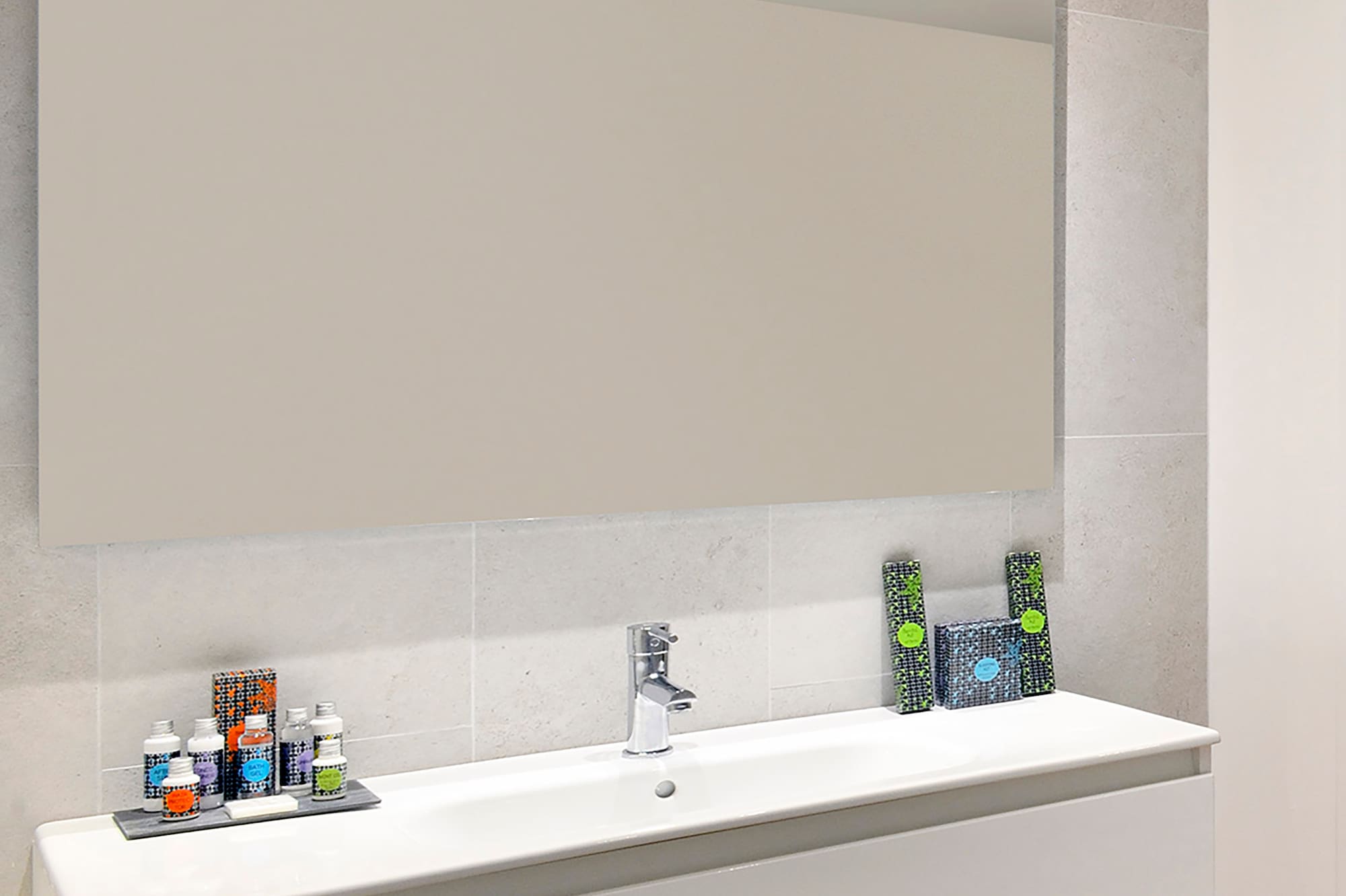 a bathroom with a mirror and sink