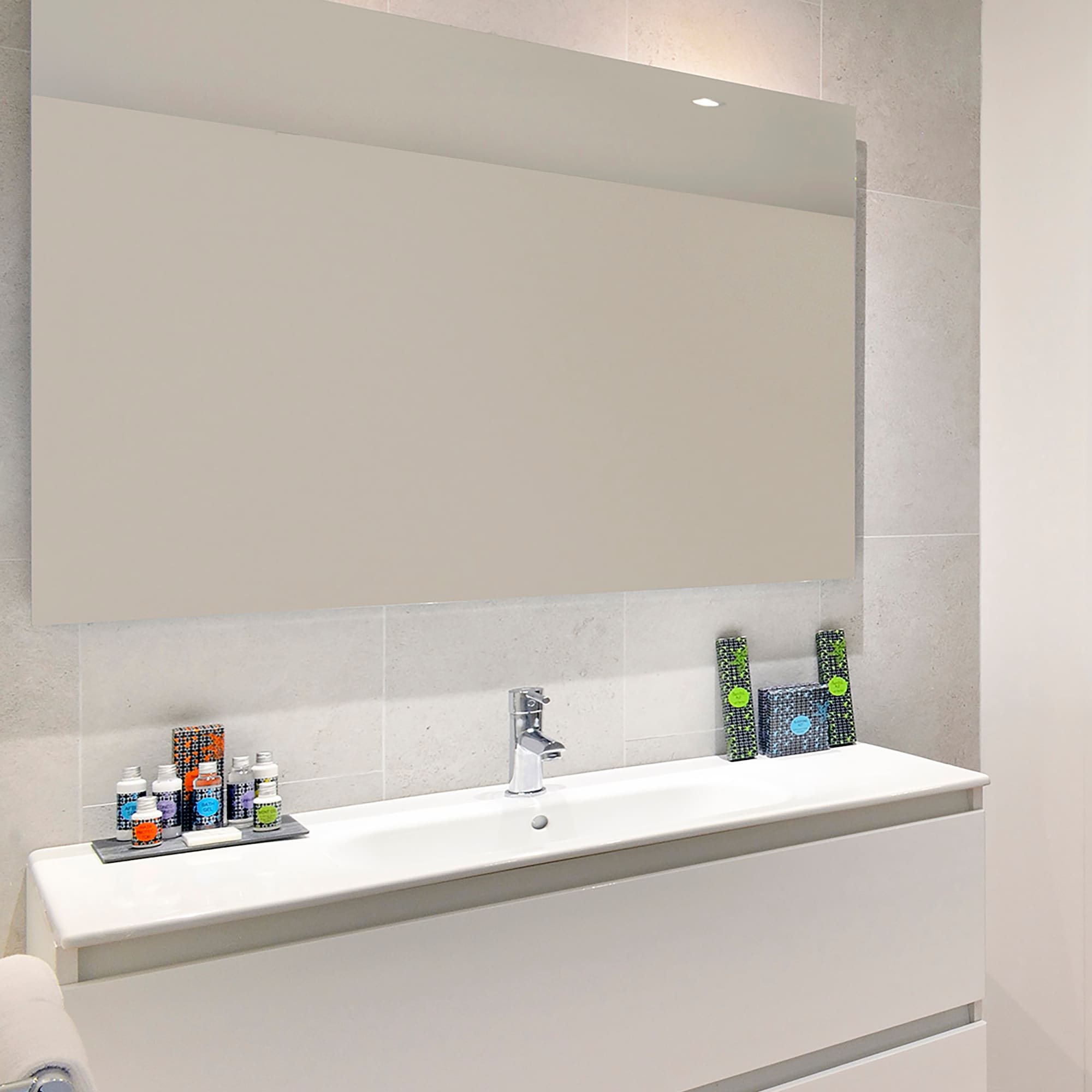 a bathroom with a mirror and sink