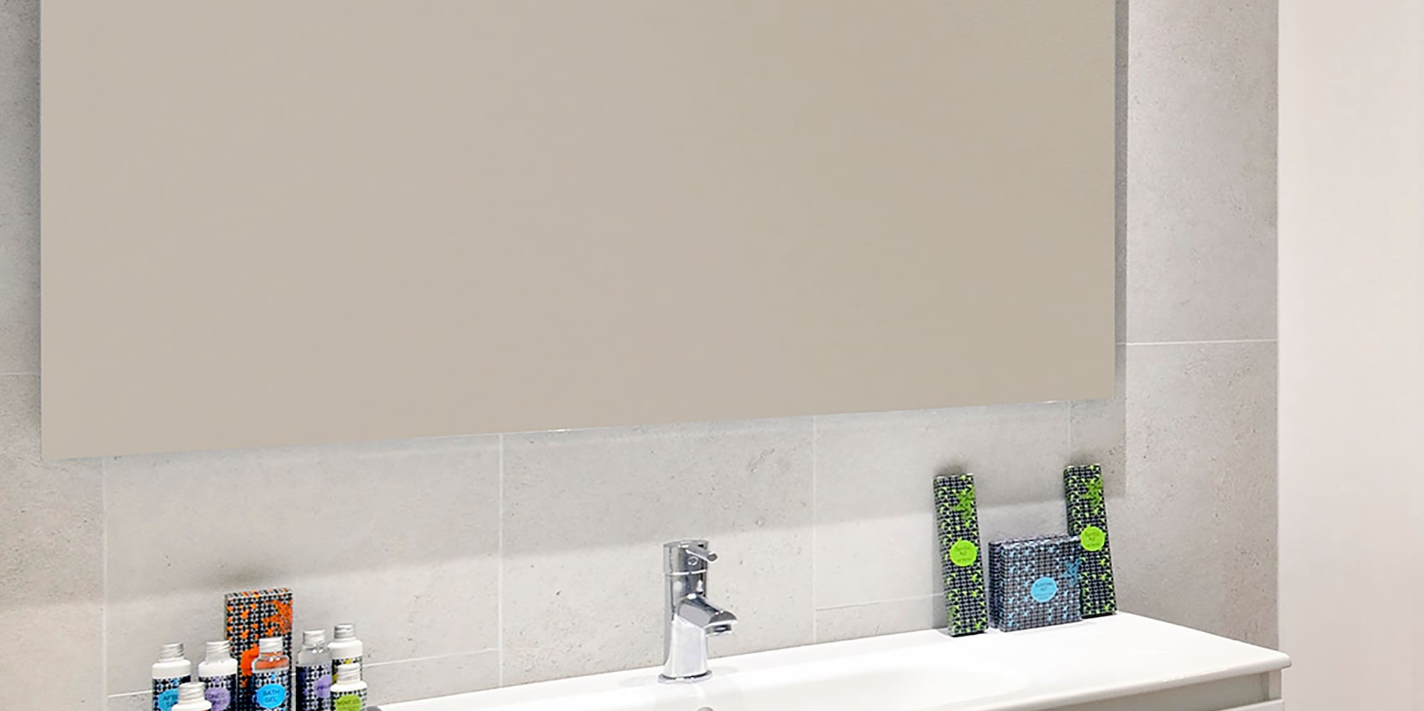 a bathroom with a mirror and sink