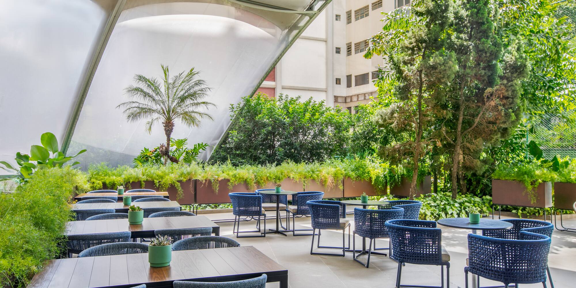a patio with tables and chairs