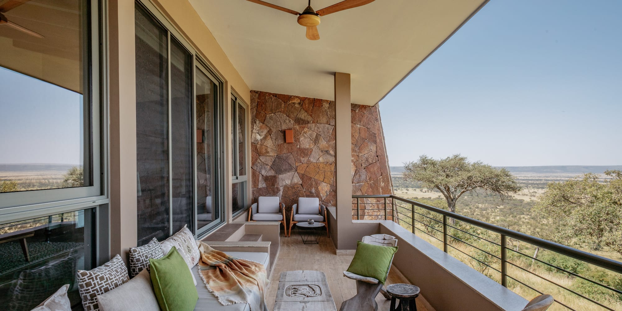 a patio with a table and chairs
