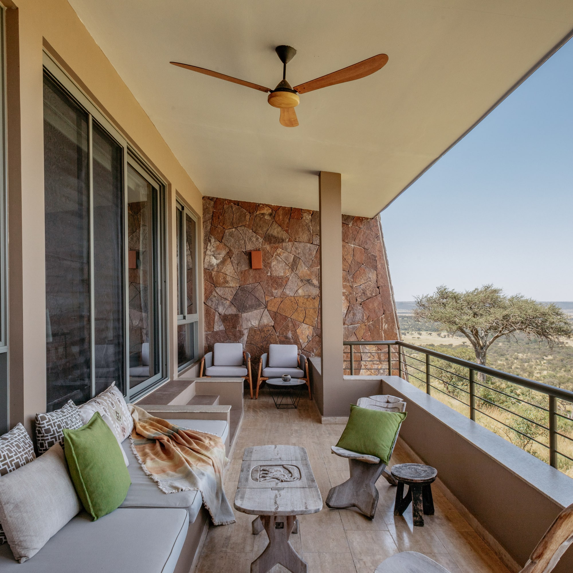 a patio with a table and chairs