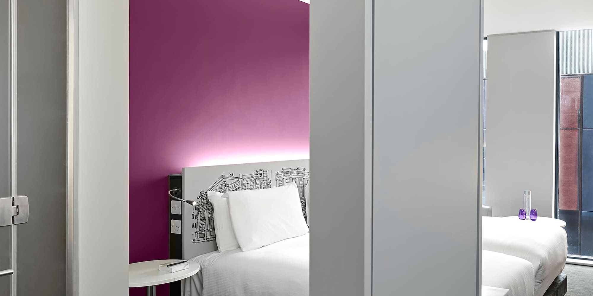 a room with a bed and a mirror