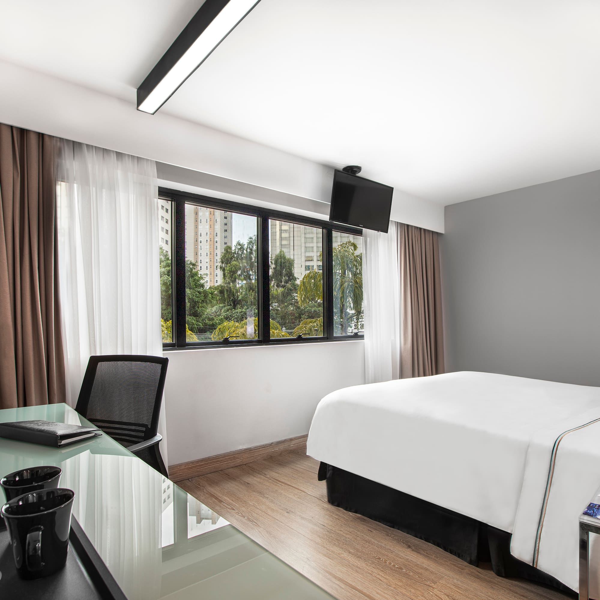 a room with a bed and a desk