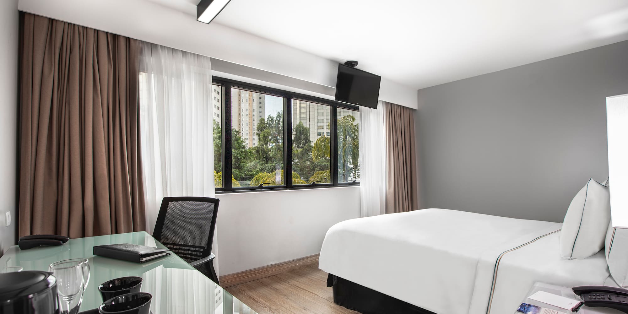 a room with a bed and a desk